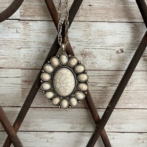 Pearl white stone medallion on silver chain